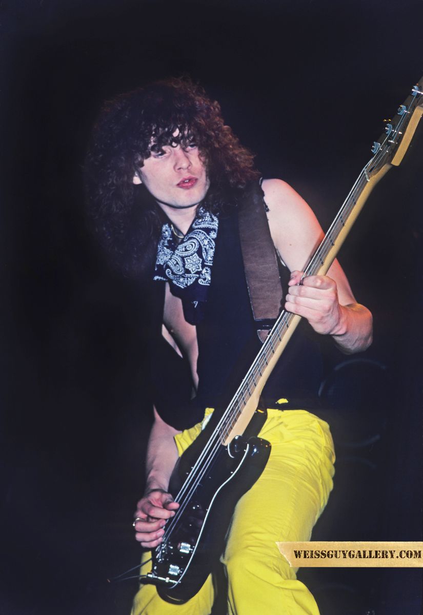 Rick Sav Savage bassist of Def Leppard Pyromania Tour 83: The Fender Precision bass guitar in this photo was stolen. It was one of Savs favorites. Id have to check out the facts but I think it was later found and had something to do with being buried in a backyard somewhere-all a bit weird. Dont quote me on it. Ill ask him and give you an update. Sav is one of the founding members of the band along with Joe. Savs favorite band is Queen. I always hear it in the songs and riffs that he comes up with. This helps when you throw all of these influences in the pot. Together they all ultimately come out in the Def Leppard sound.
