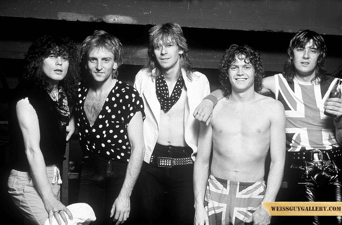 Def Leppard: ���On tour somewhere in the US in 1983. This was our Pyromania tour. We went from opening act to headliner and outrageous album sales. This tour was a pinch me moment because all of our dreams actually became a reality. Rick Allen, our drummer, sporting the union jacks was a wee babe at 19 years old in this photo. I was the oldest at 25. We had no idea for an image. Joe Elliot and Rick got their garb from a London market and all of a sudden that was the look.���